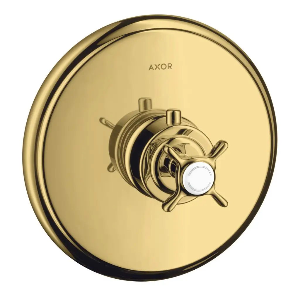 Thermostat mit Kreuzgriff in polierter Gold-Optik von AXOR, montiert auf einer runden Plattenoberfläche, geeignet für Unterputzinstallation.
